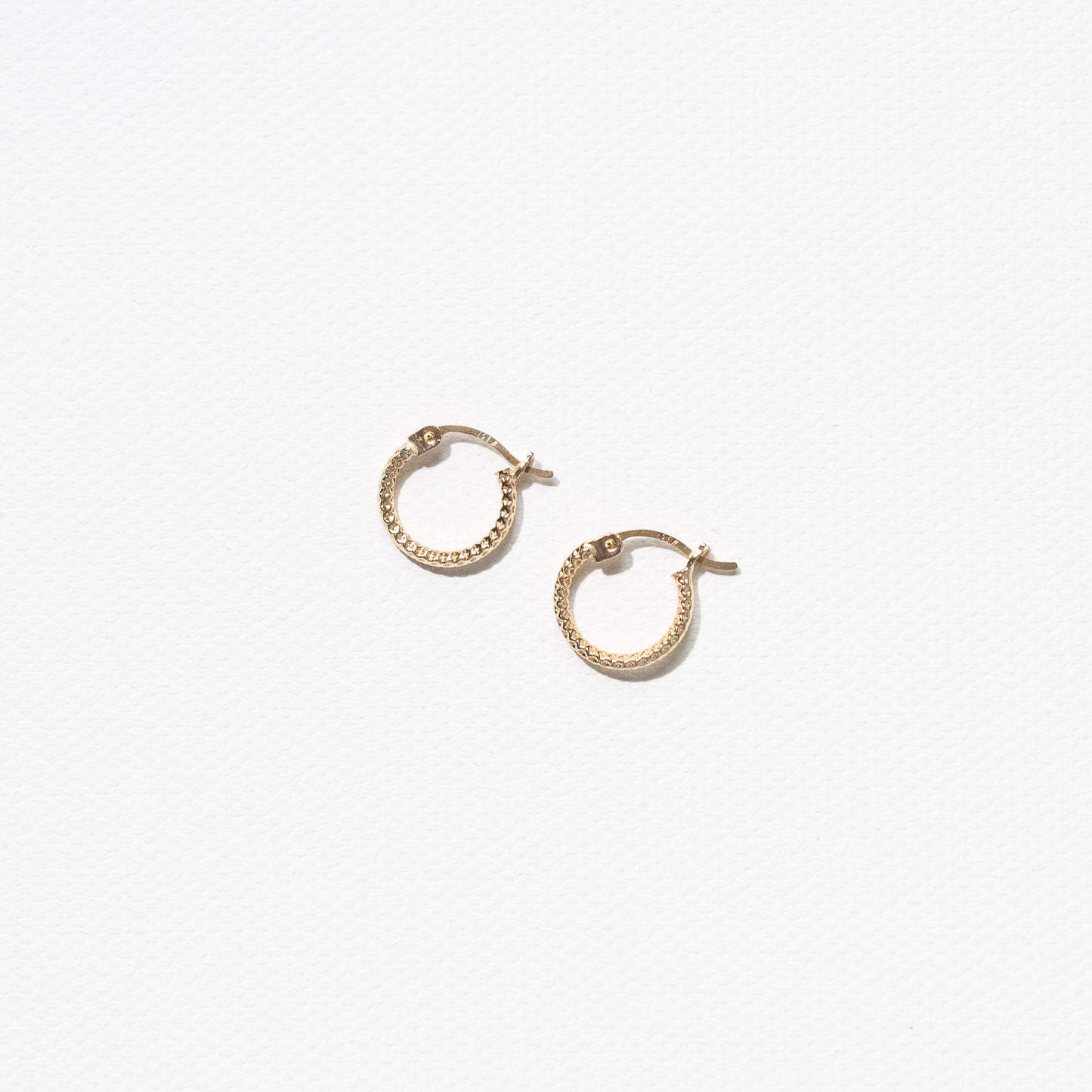 10 Karat Yellow Gold Textured Hoops Earrings by Athina Kadas. Crafted in Italy